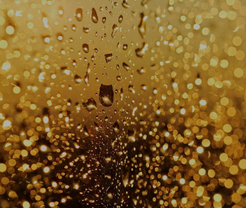 golden raindrops on a window, image by Nika Akin, on Pixabay